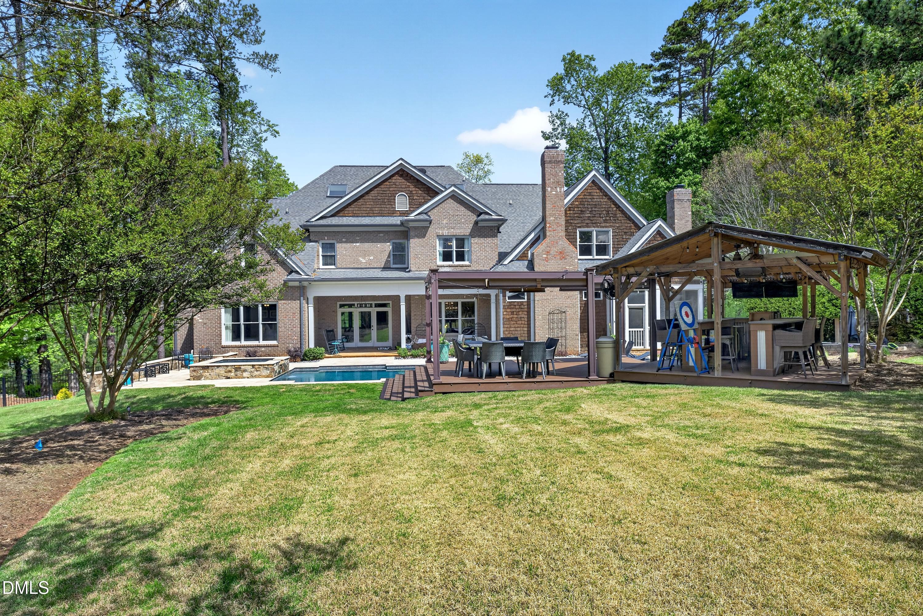 3513 Eilla Bluffs Court Raleigh, NC 27606 - Photo 73 of 86 a front view of a house with swimming pool and furniture