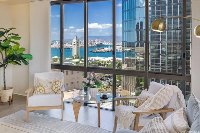 a living room with furniture and a floor to ceiling window
