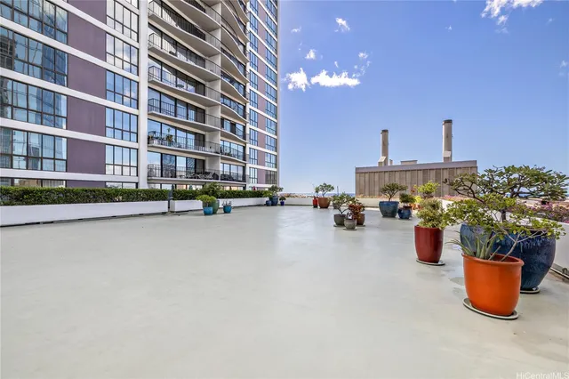 a view of city from balcony with seating space