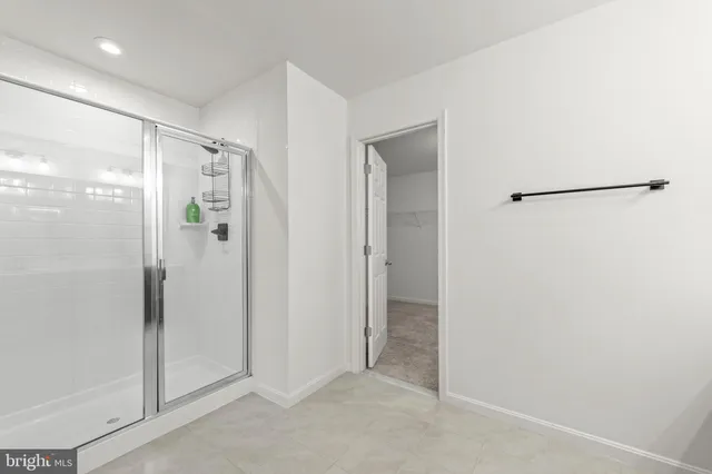 a view of bathroom with a glass shower door