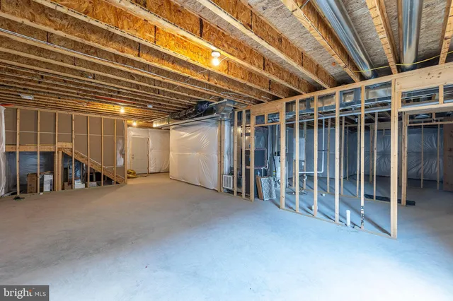 a view of an empty room with stairs