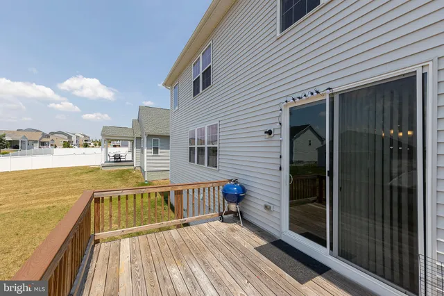 a view of a balcony with wooden floor