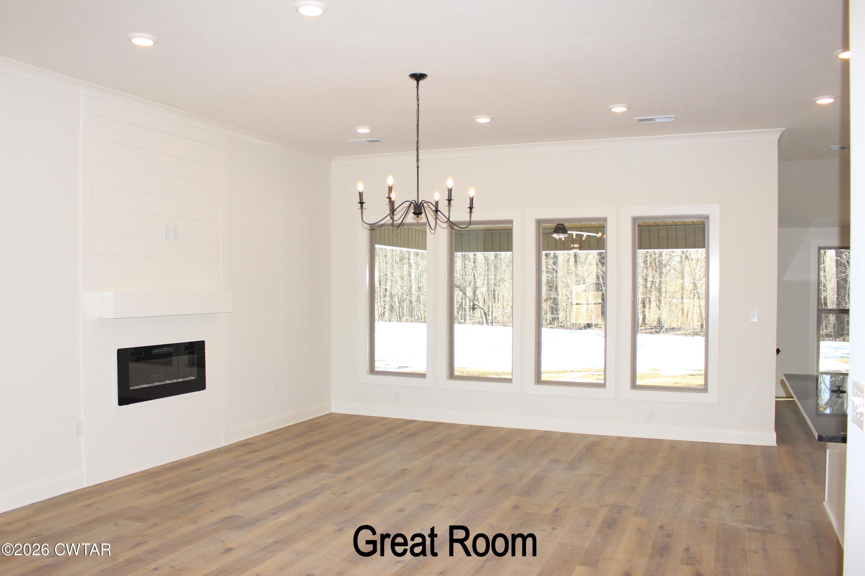 148 Calumet Cove Medina, TN 38355 - Photo 5 of 21 a view of an empty room with a window and wooden floor