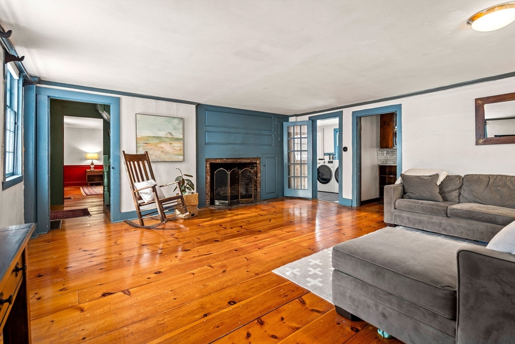 4 Thorndike Street Dunstable, MA 01827 - Photo 12 of 35 a living room with furniture and a fireplace