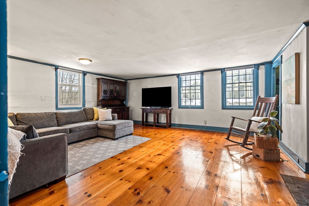 4 Thorndike Street Dunstable, MA 01827 - Photo 14 of 35 a living room with furniture and a flat screen tv
