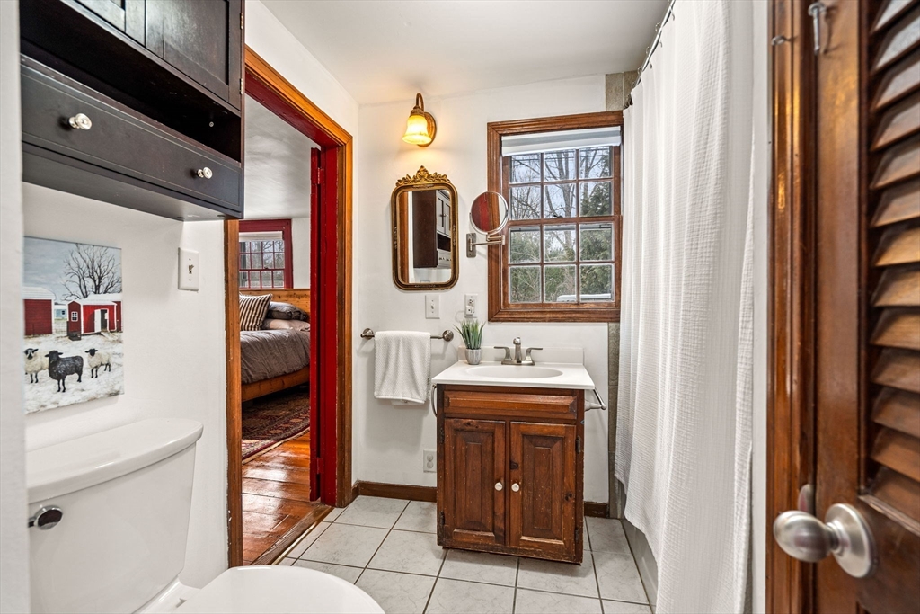 4 Thorndike Street Dunstable, MA 01827 - Photo 15 of 35 a en suite bathroom with a toilet sink and mirror