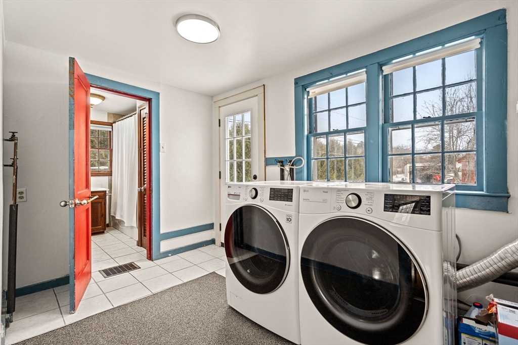 4 Thorndike Street Dunstable, MA 01827 - Photo 18 of 35 a view of entryway with washer and dryer