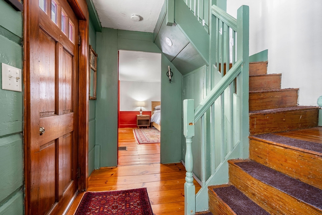 4 Thorndike Street Dunstable, MA 01827 - Photo 19 of 35 a view of entryway and hall with wooden floor