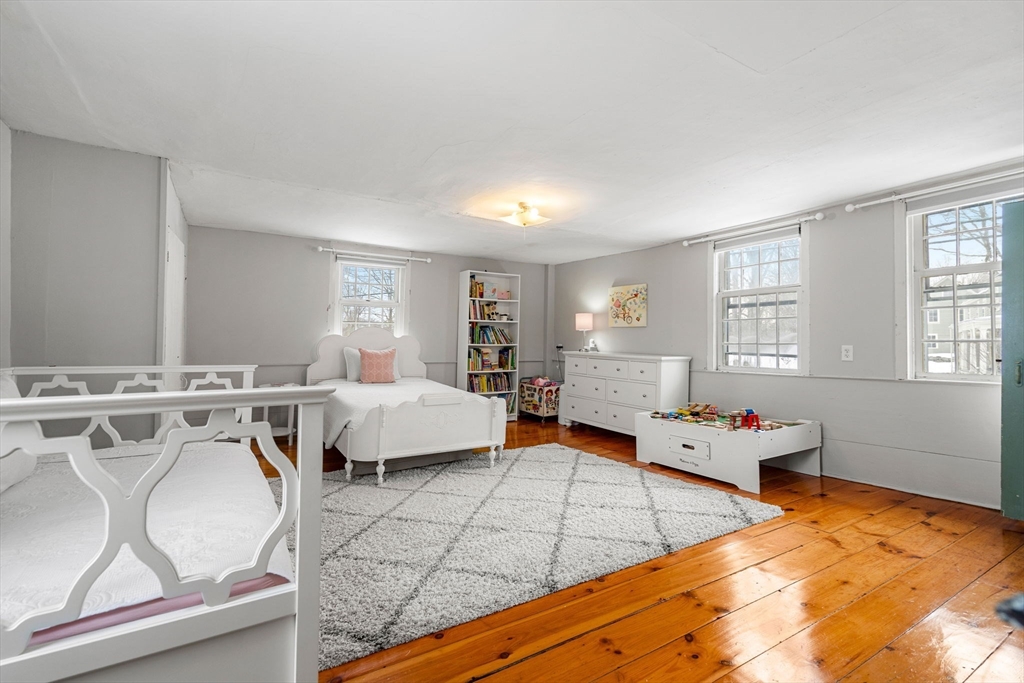 4 Thorndike Street Dunstable, MA 01827 - Photo 23 of 35 a spacious bedroom with a bed and window