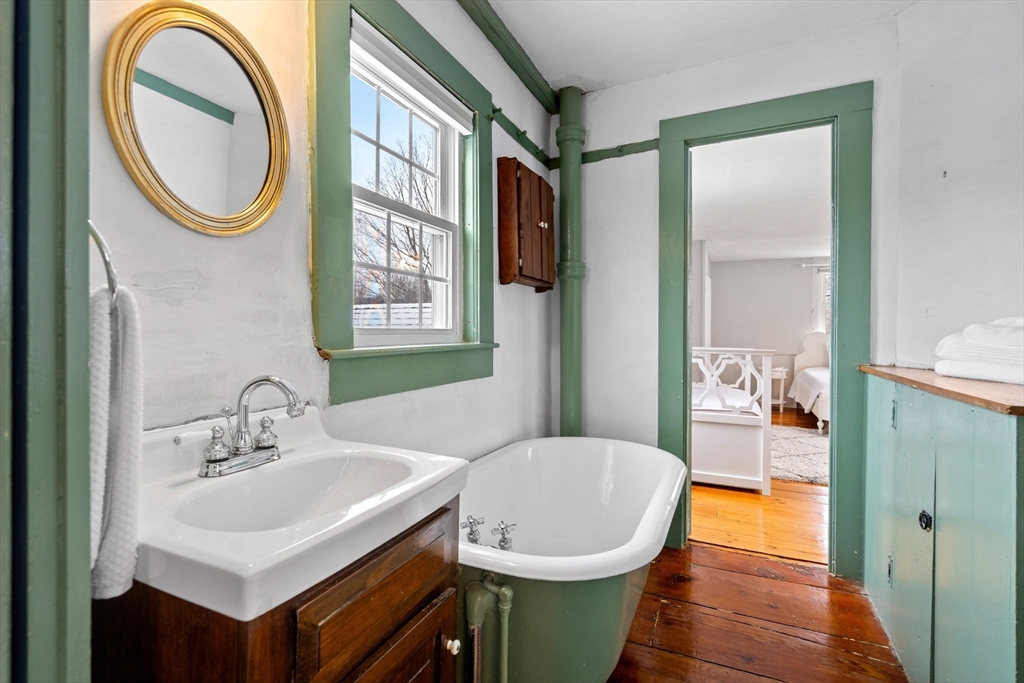 4 Thorndike Street Dunstable, MA 01827 - Photo 25 of 35 a bathroom with a sink a toilet and a mirror