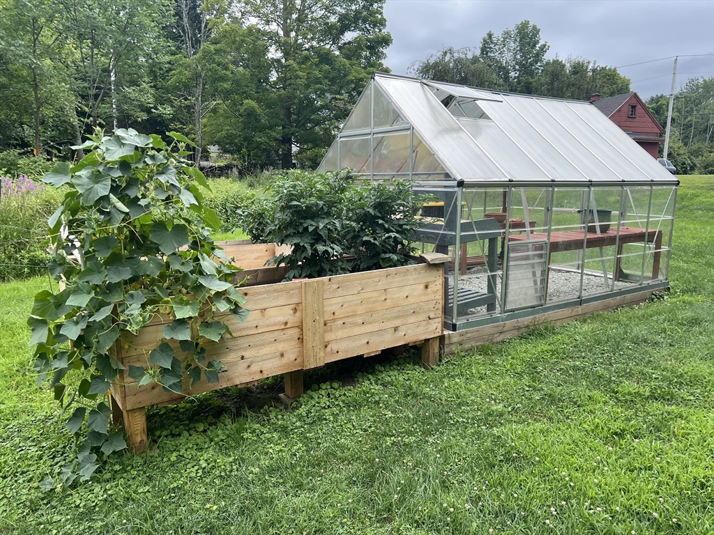 4 Thorndike Street Dunstable, MA 01827 - Photo 34 of 35 a view of a house with a backyard and sitting area