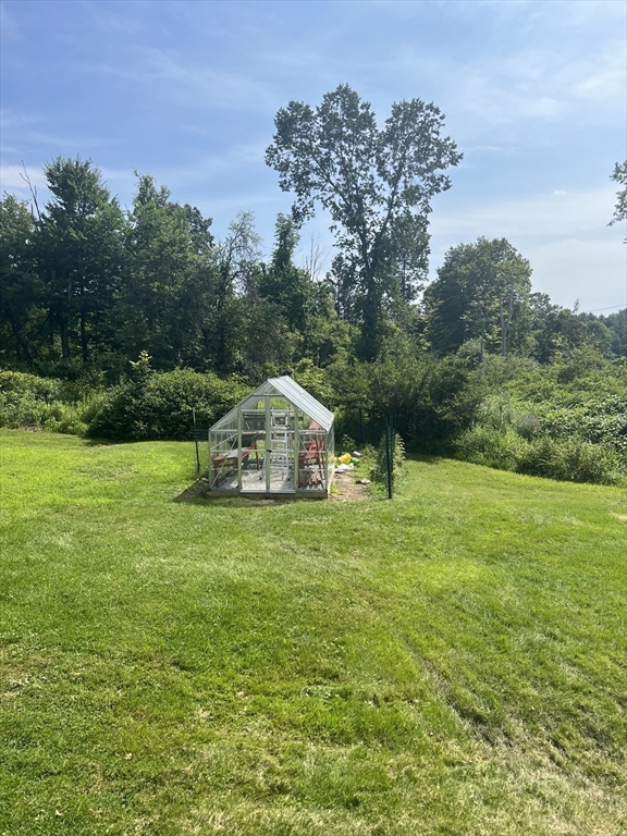 4 Thorndike Street Dunstable, MA 01827 - Photo 35 of 35 a front view of a house with a yard