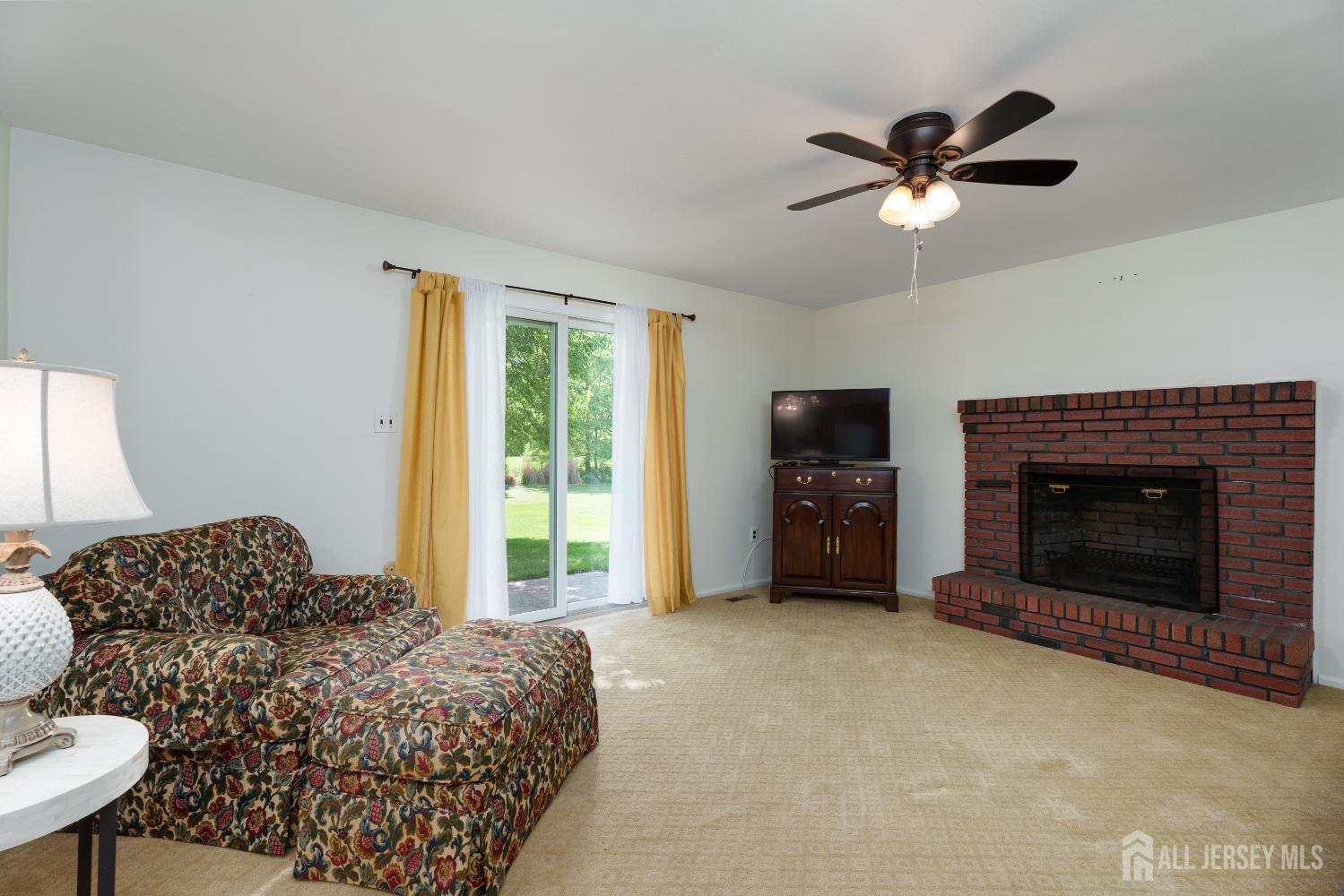 132 Fairfield Road Princeton, NJ 08540 - Photo 10 of 22 a spacious bedroom with a bed and a fireplace