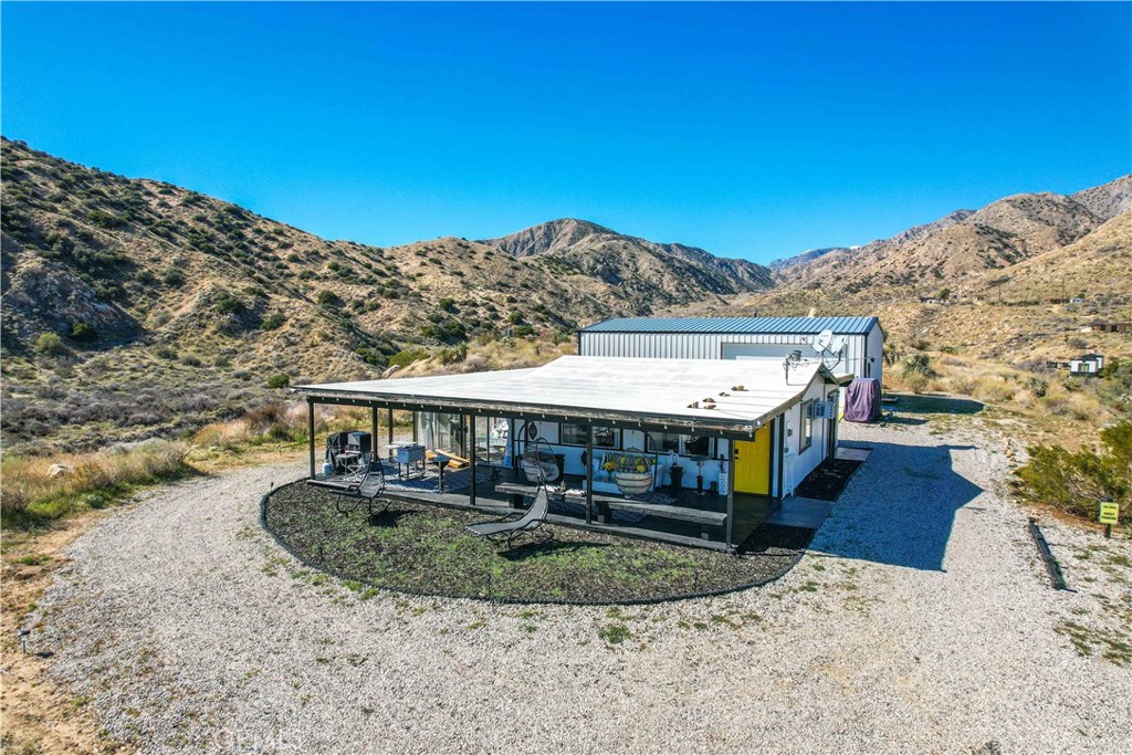 49490 Big Morongo Canyon Road Morongo Valley, CA 92256 - Photo 6 of 75 a view of a house with a swimming pool