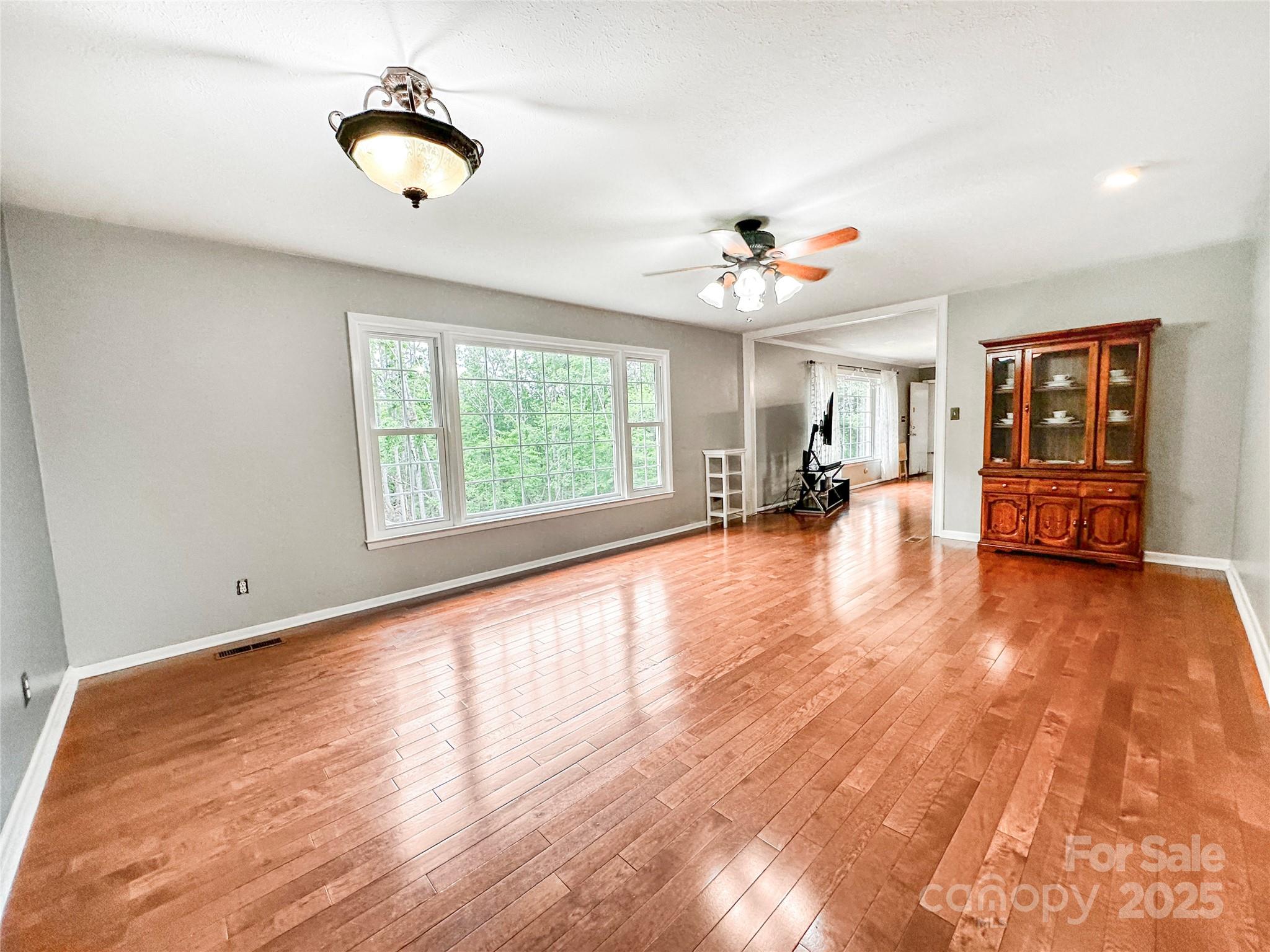 200 Woodside Drive Morganton, NC 28655 - Photo 12 of 48 wooden floor in an empty room with a window