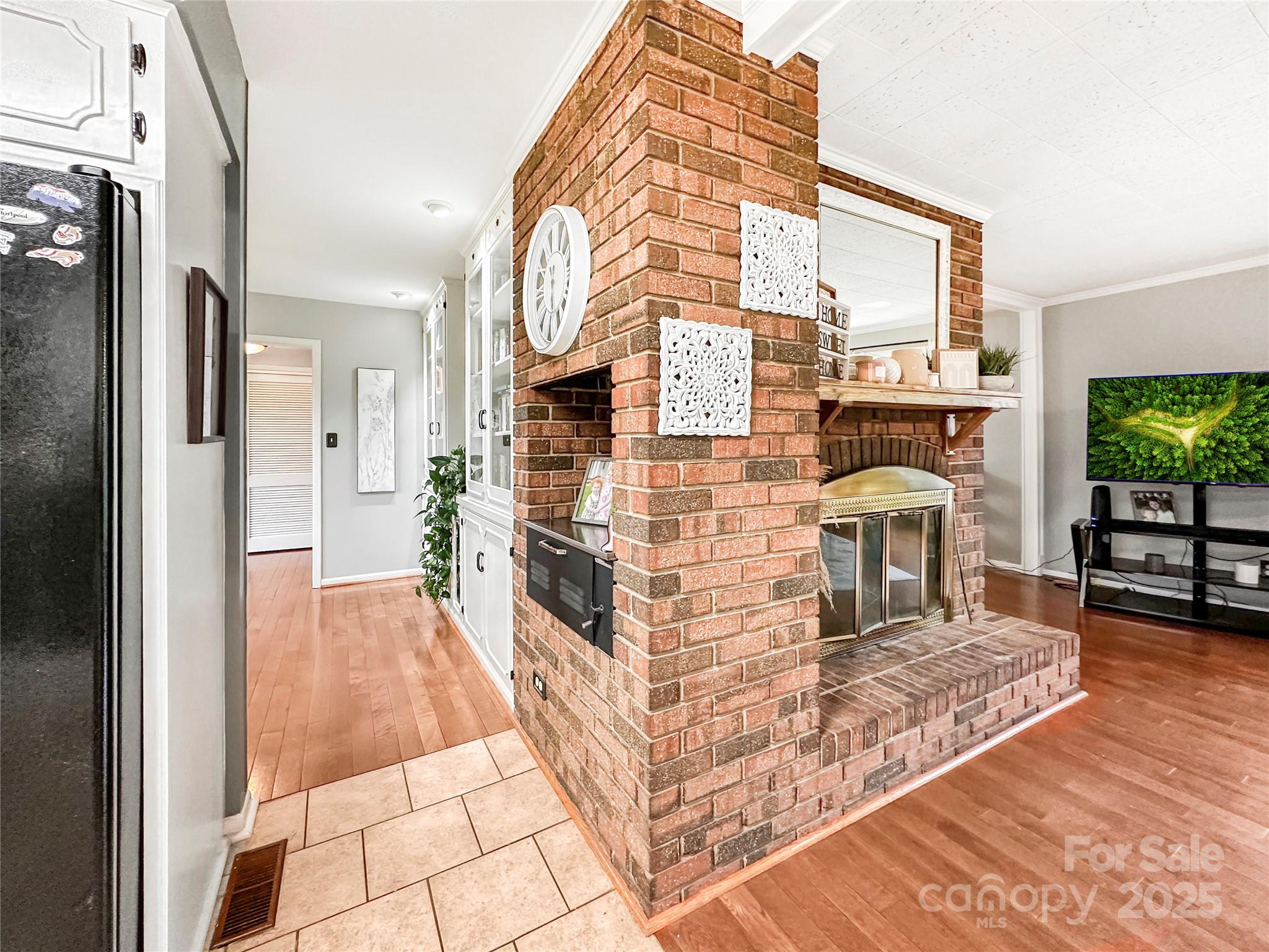 200 Woodside Drive Morganton, NC 28655 - Photo 13 of 48 a living room with fireplace furniture and a flat screen tv
