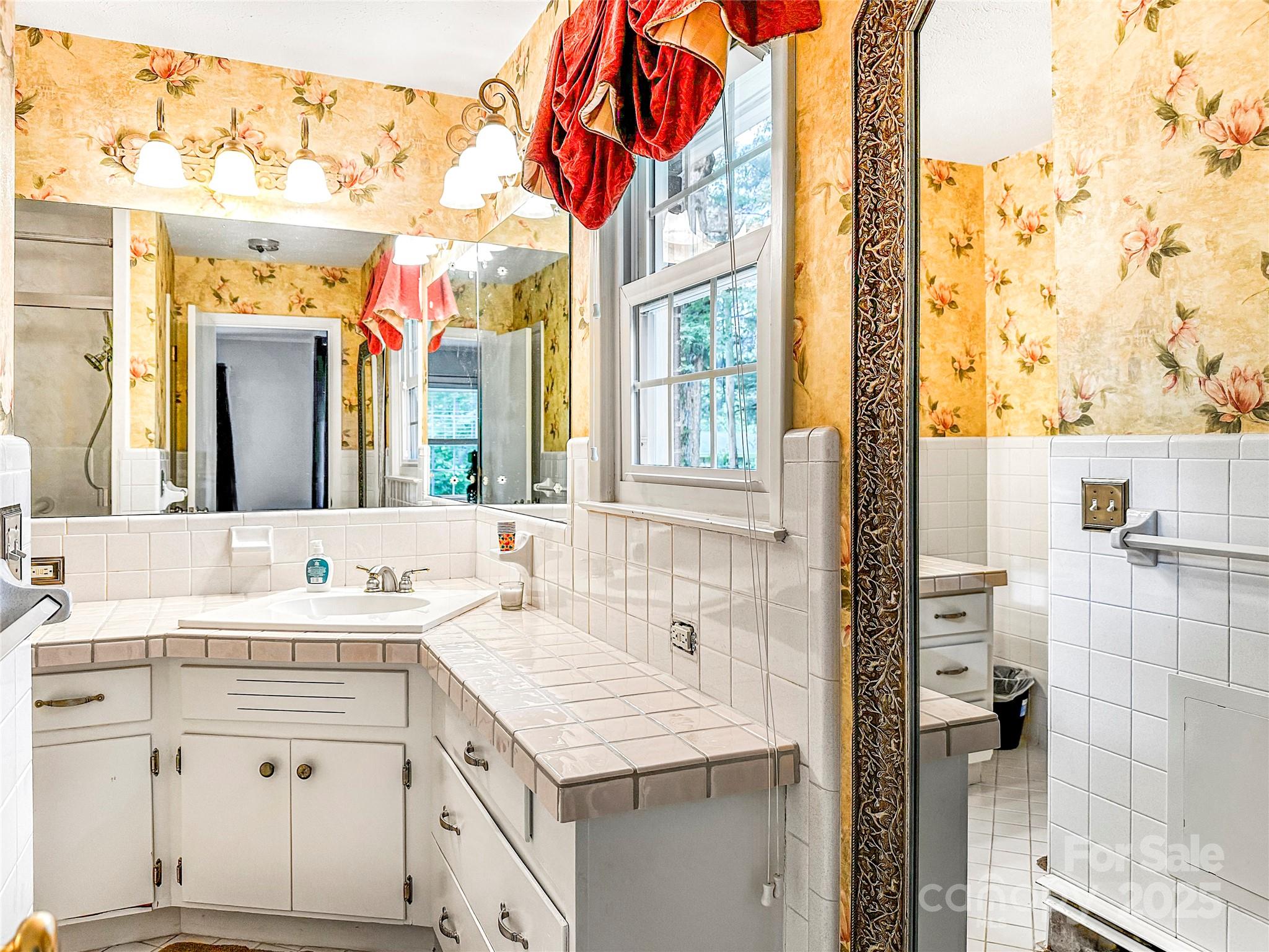 200 Woodside Drive Morganton, NC 28655 - Photo 24 of 48 a bathroom with a sink vanity and a mirror