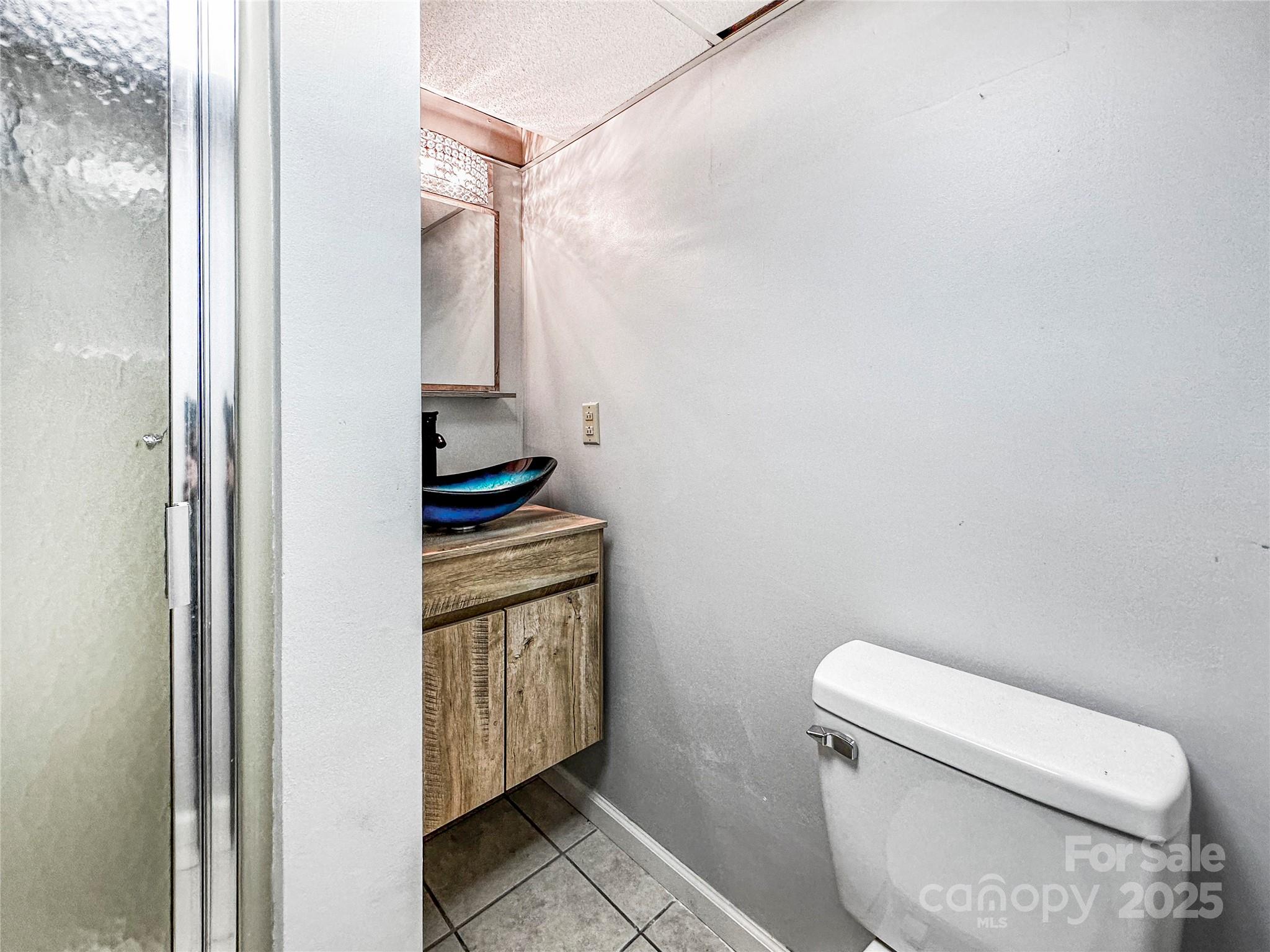 200 Woodside Drive Morganton, NC 28655 - Photo 29 of 48 a bathroom with a toilet and a shower
