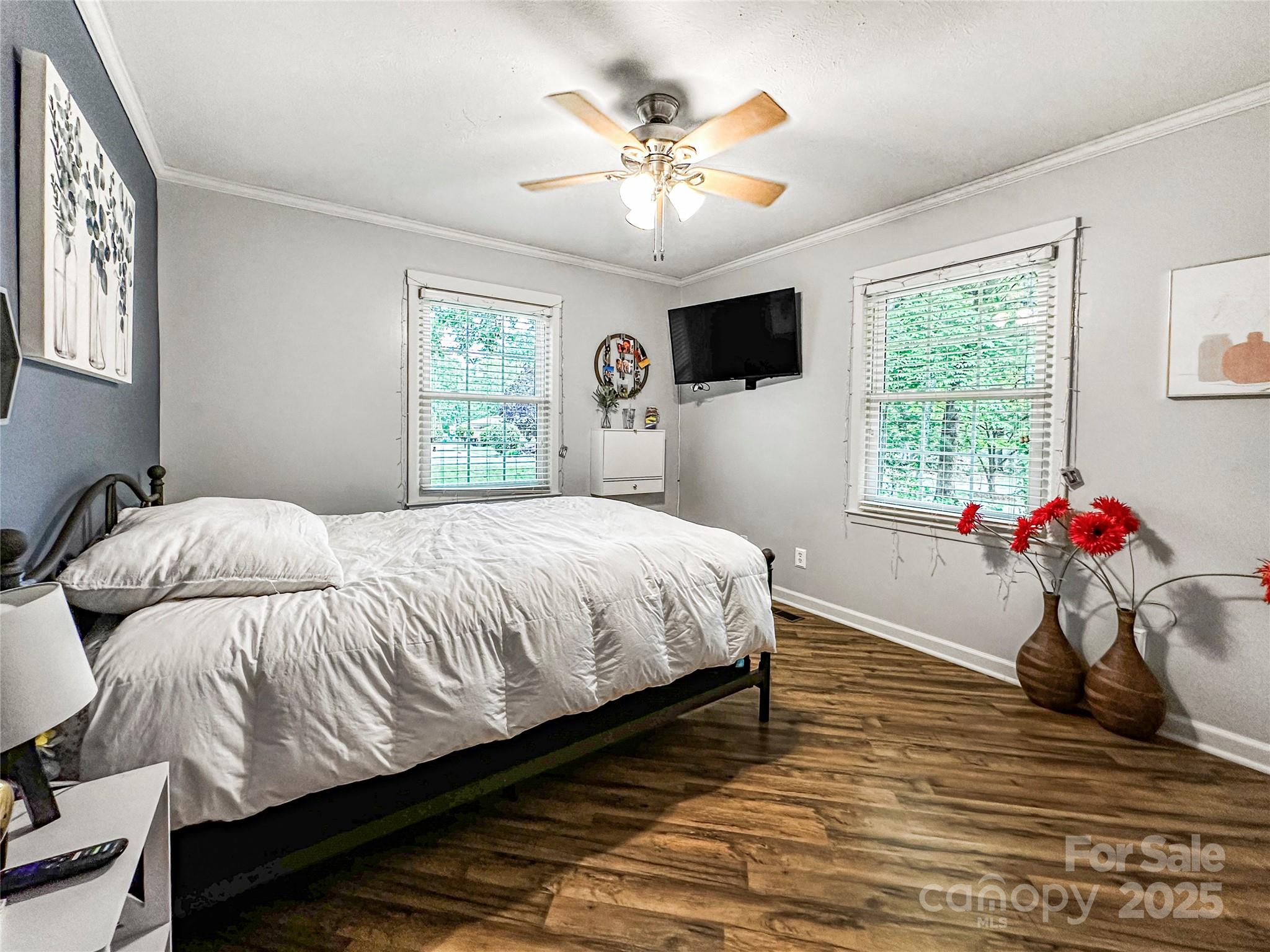 200 Woodside Drive Morganton, NC 28655 - Photo 30 of 48 a bedroom with a bed and a chandelier