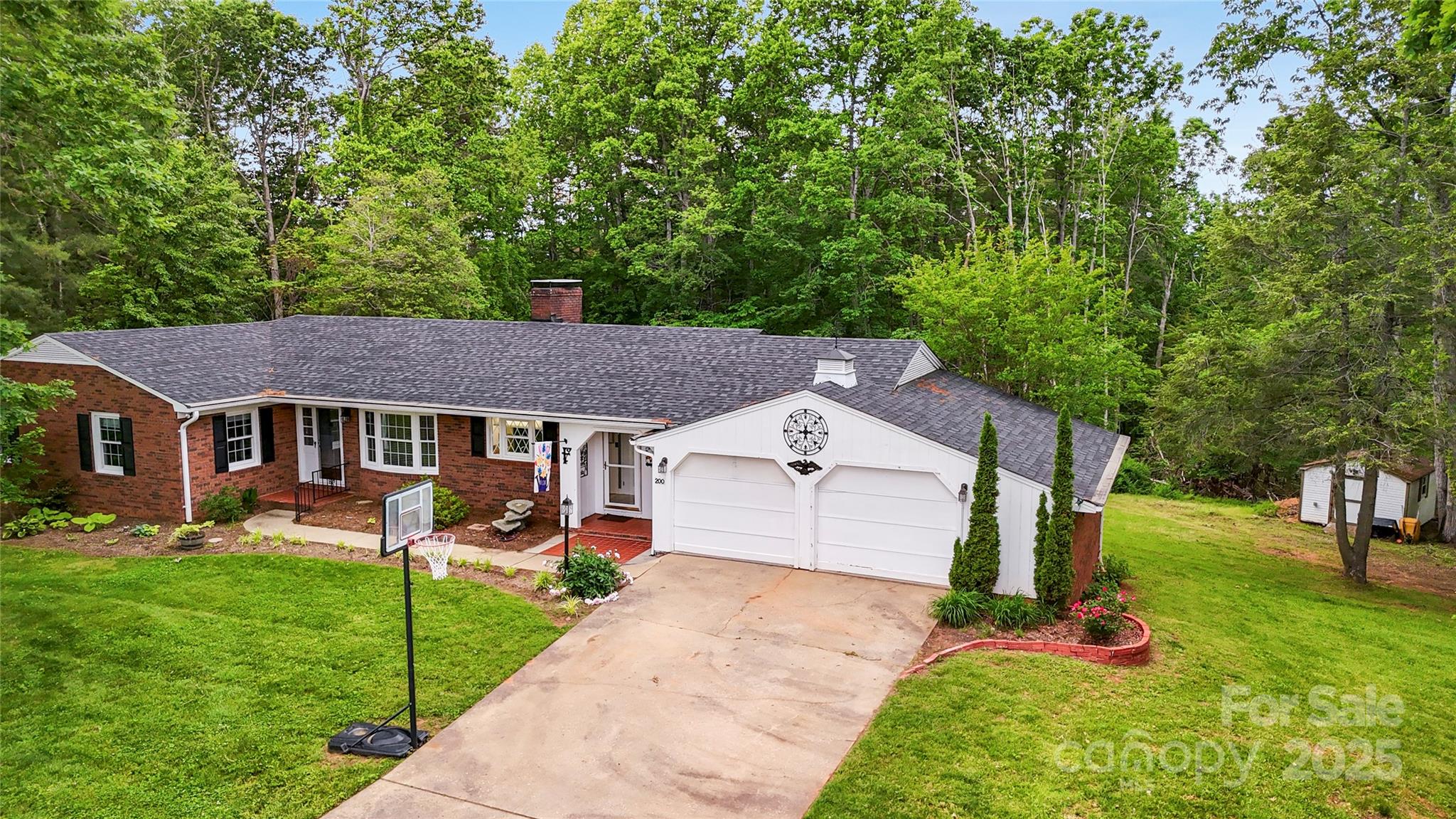200 Woodside Drive Morganton, NC 28655 - Photo 3 of 48 a front view of a house with garden