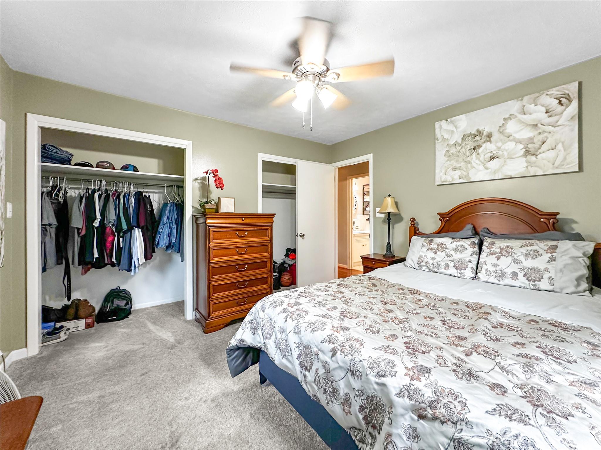 200 Woodside Drive Morganton, NC 28655 - Photo 32 of 48 a bedroom with a bed and a walk in closet