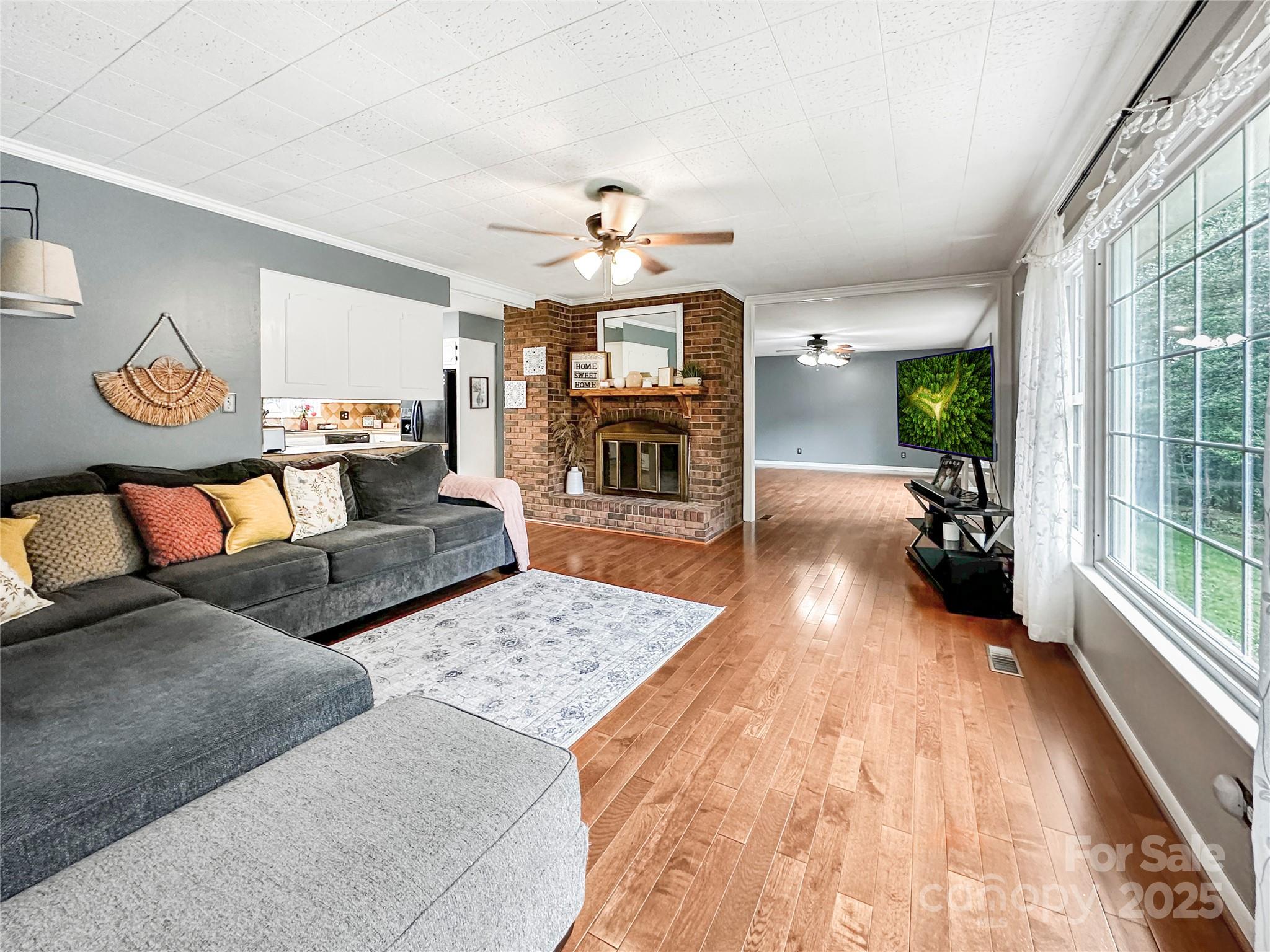 200 Woodside Drive Morganton, NC 28655 - Photo 8 of 48 a living room with furniture and a fireplace