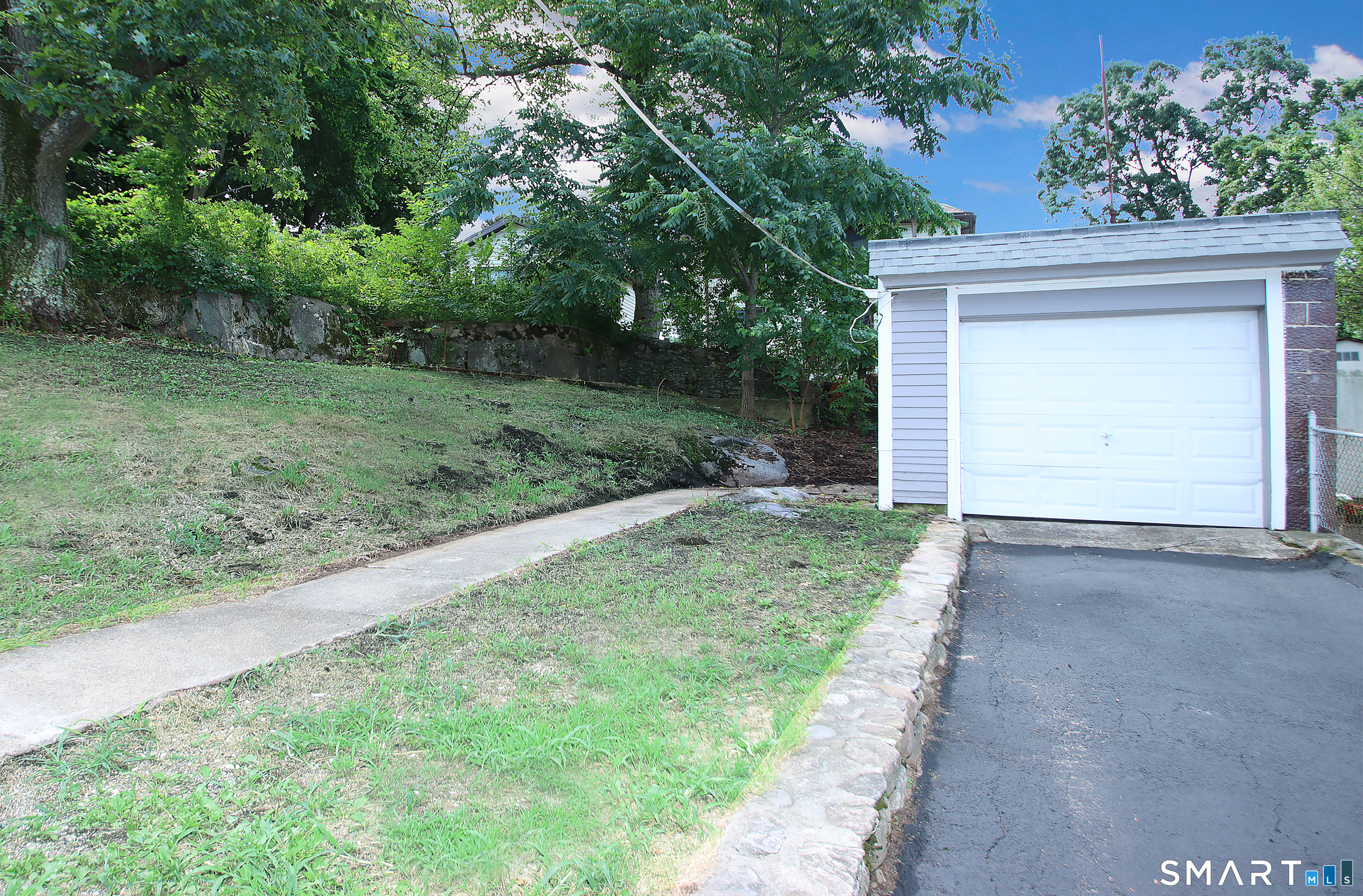 217 Ledgeside Avenue Waterbury, CT 06708 - Photo 23 of 24 a view of a house with a yard