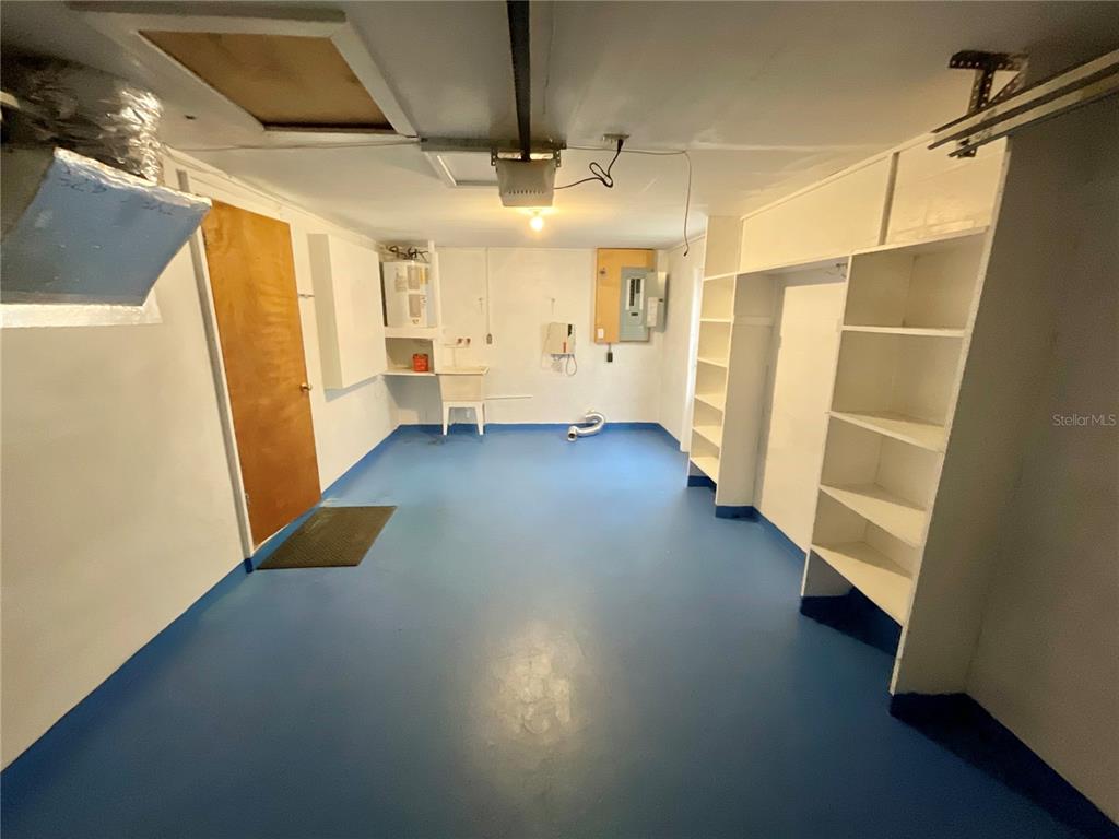 4810 Flora Avenue Holiday, FL 34690 - Photo 12 of 14 a view of hallway with stairs and wooden floor