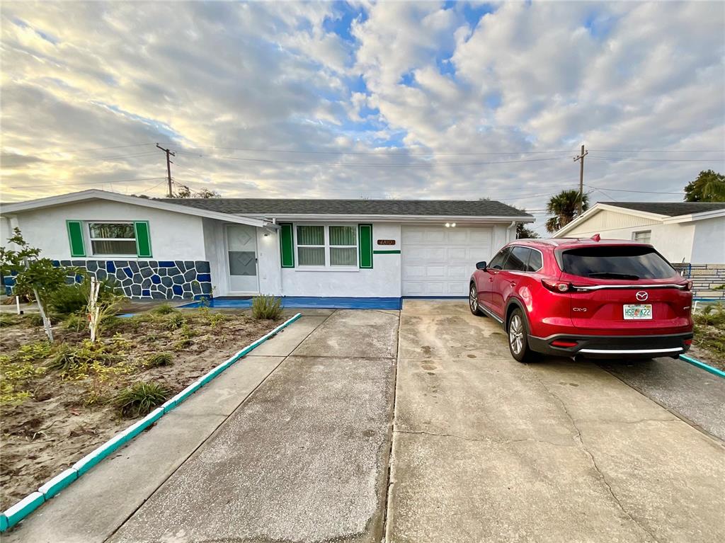 4810 Flora Avenue Holiday, FL 34690 - Photo 2 of 14 a view of a car park in front of house