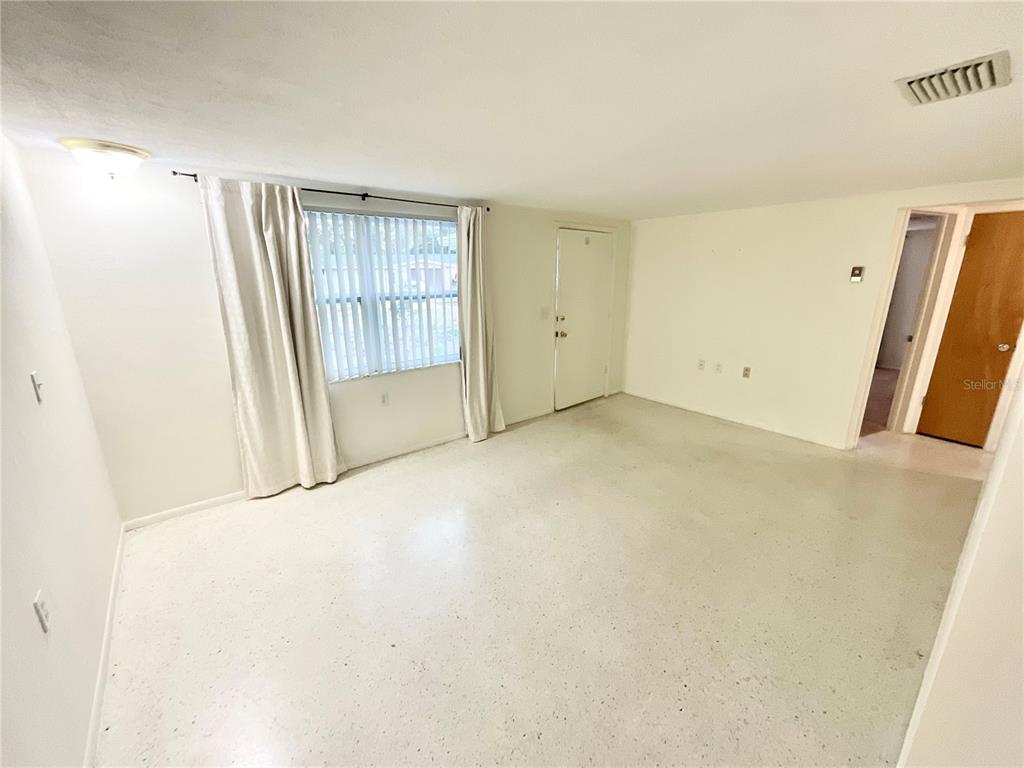 4810 Flora Avenue Holiday, FL 34690 - Photo 5 of 14 an empty room with windows