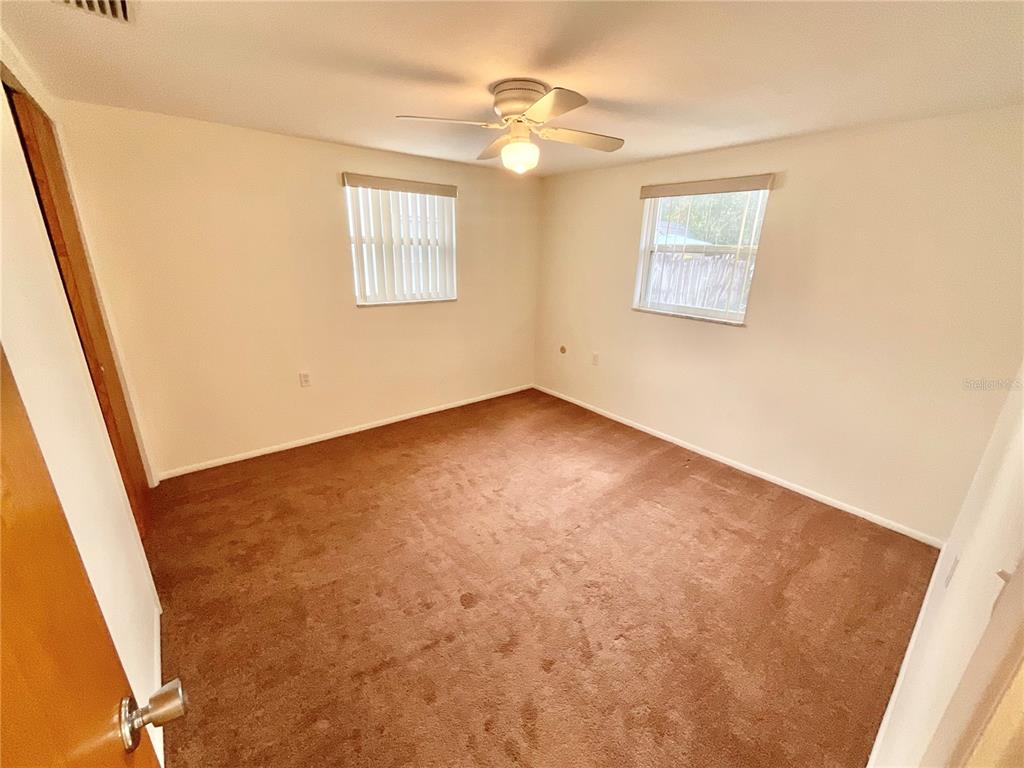 4810 Flora Avenue Holiday, FL 34690 - Photo 8 of 14 a view of an empty room with a window