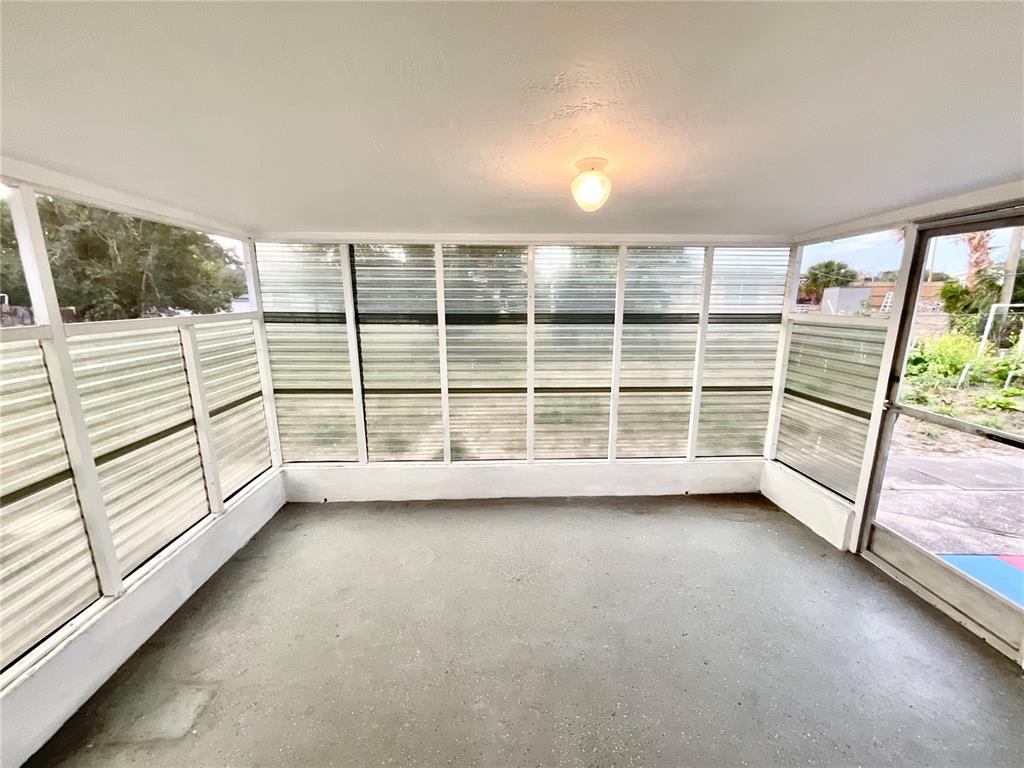 4810 Flora Avenue Holiday, FL 34690 - Photo 10 of 14 an empty room with windows