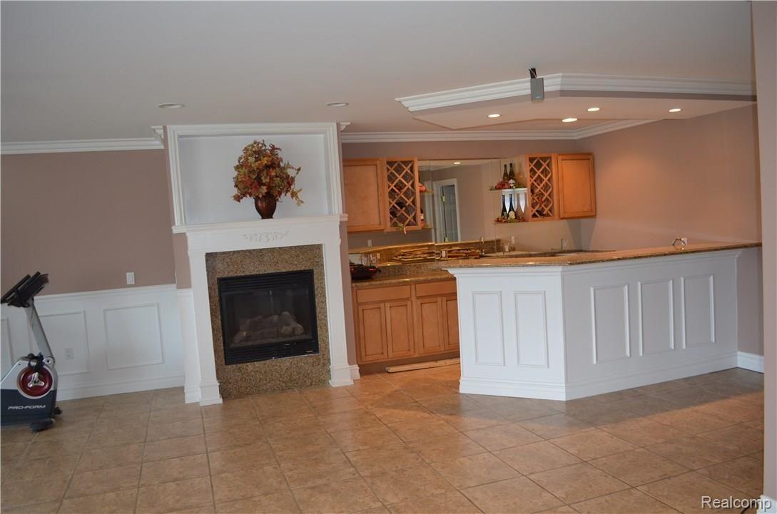 67808 Campground Road Washington, MI 48095 - Photo 73 of 77 WET BAR AND FIREPLACE, GREAT FOR ENTERTAINING! - FINISHED BASEMENT VIEW 9