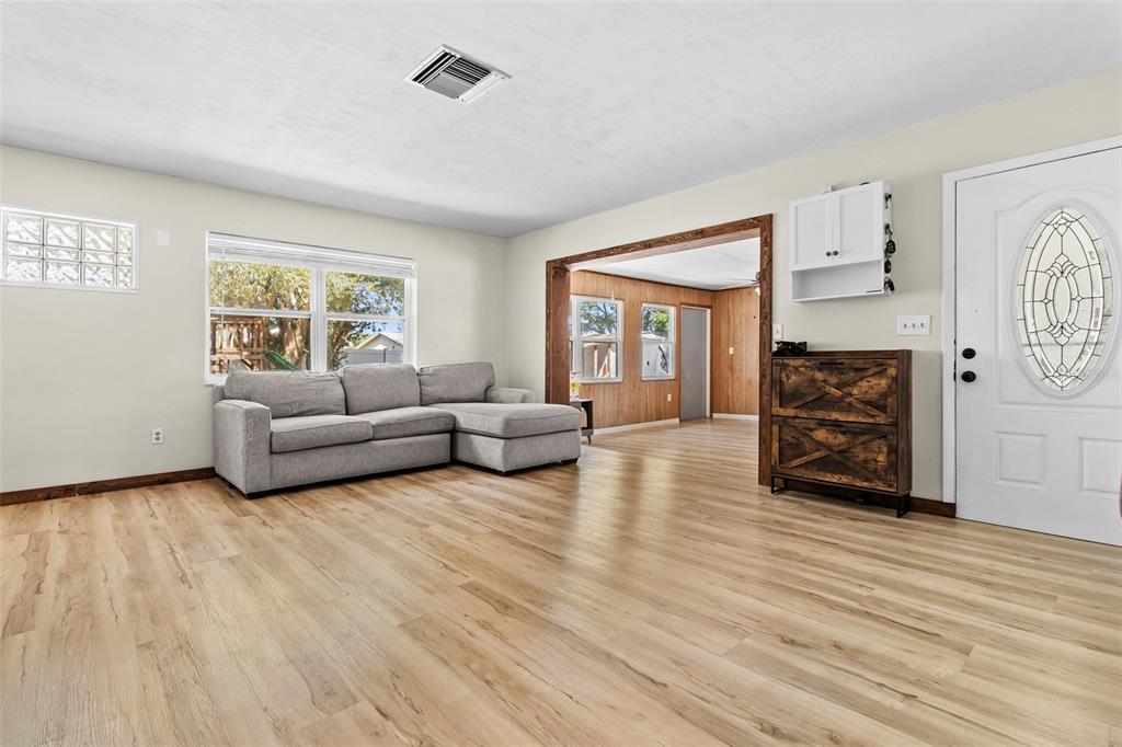 6221 Dalton Street Spring Hill, FL 34606 - Photo 13 of 40 a living room with furniture and a wooden floor