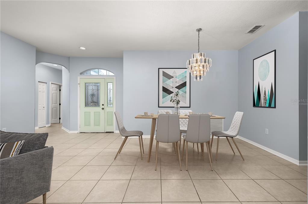 8231 Southwest 79th Court Ocala, FL 34476 - Photo 12 of 39 a dining room with furniture and window