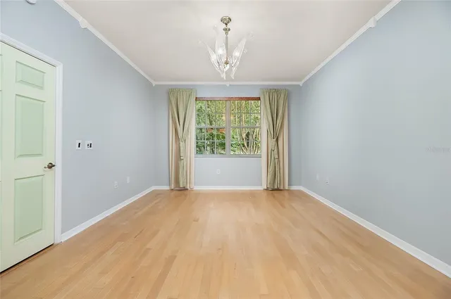 a bedroom with bed and window