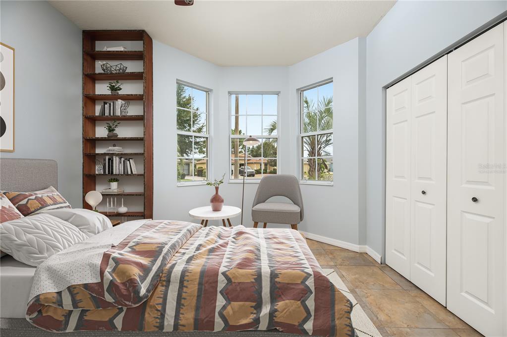 8231 Southwest 79th Court Ocala, FL 34476 - Photo 33 of 39 a bedroom with a bed and a window