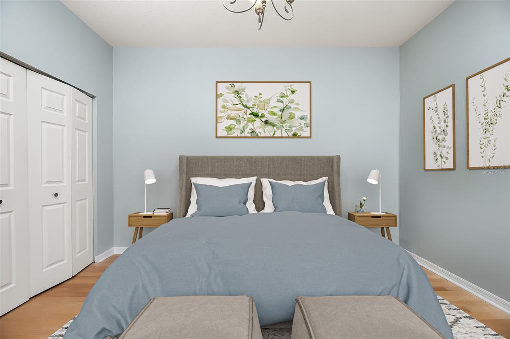 8231 Southwest 79th Court Ocala, FL 34476 - Photo 37 of 39 a bed room with a bed and a painting on the wall