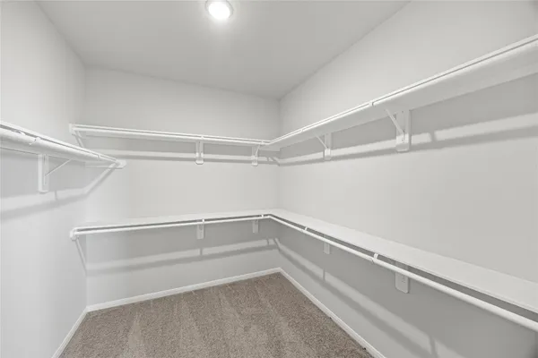 a view of an empty walk in closet