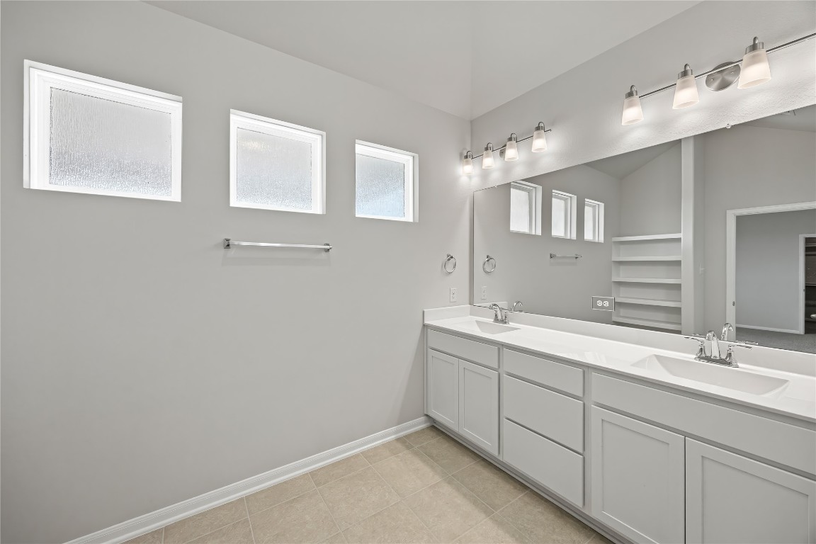 648 Canadian Trail Dayton, TX 77535 - Photo 23 of 37 a bathroom with a double vanity sink and mirror