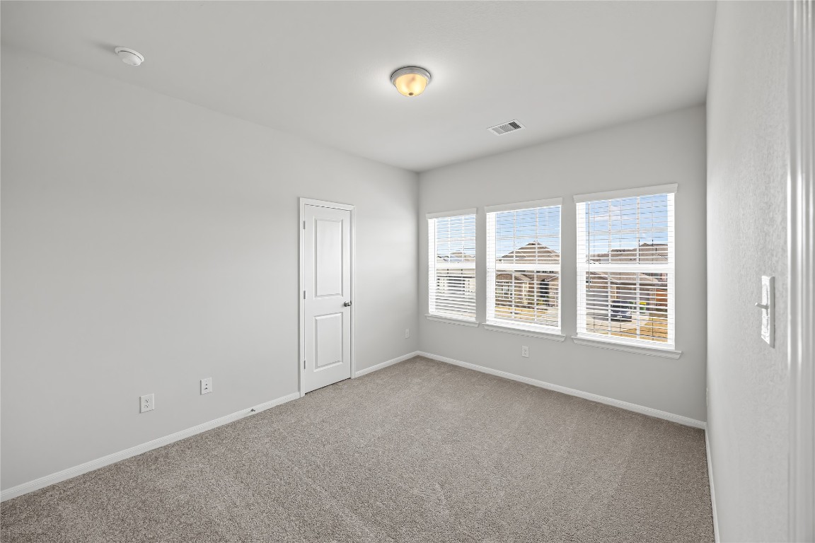 648 Canadian Trail Dayton, TX 77535 - Photo 27 of 37 a view of an empty room with a window