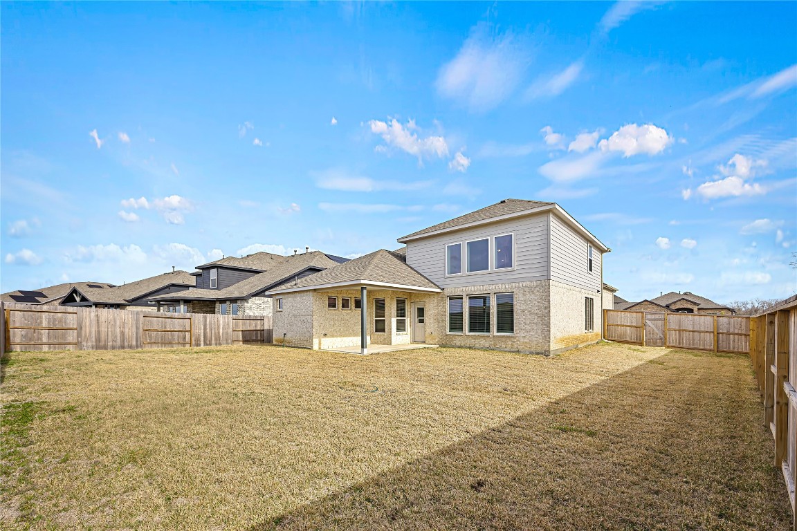 648 Canadian Trail Dayton, TX 77535 - Photo 36 of 37 a front view of a house with a yard