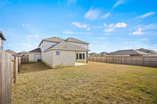 a house with yard in front of it