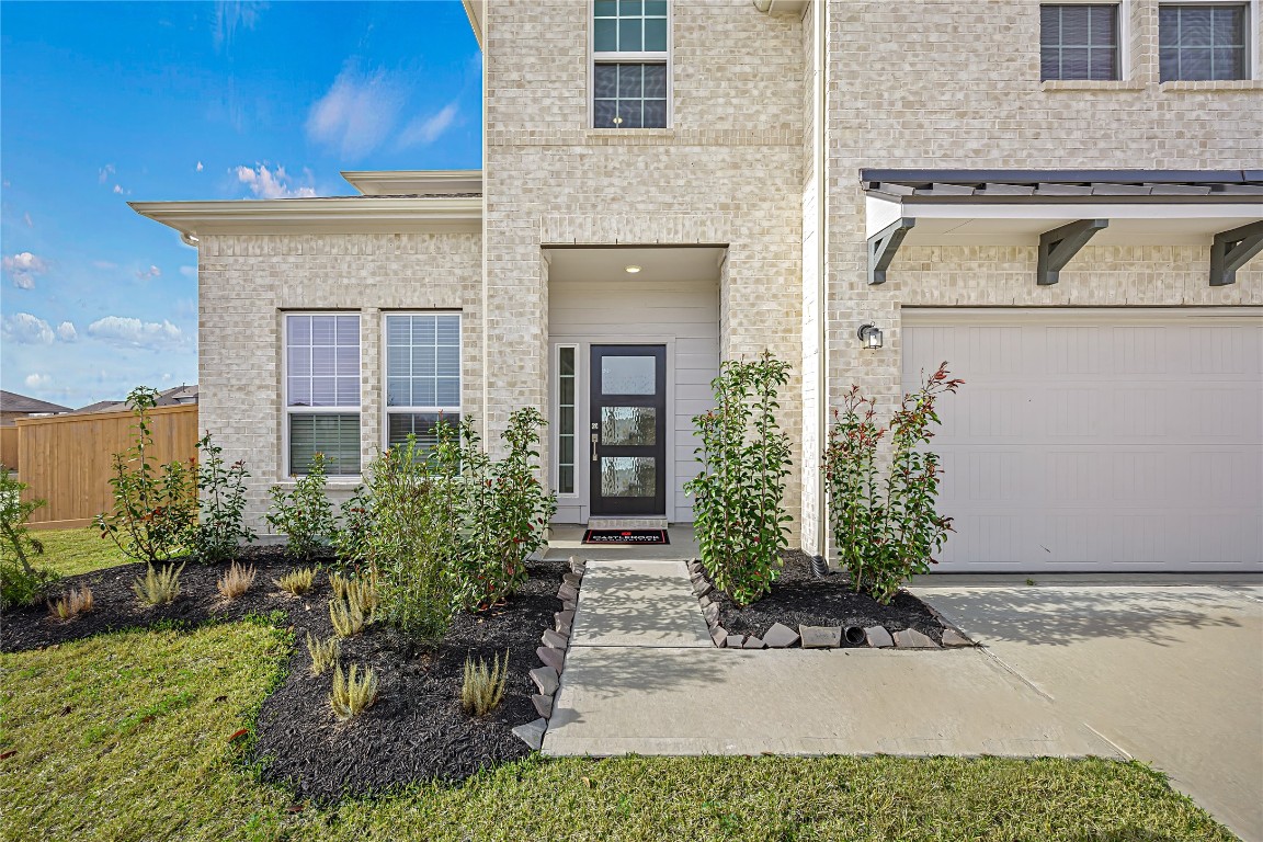 648 Canadian Trail Dayton, TX 77535 - Photo 5 of 37 front view of house with potted plants