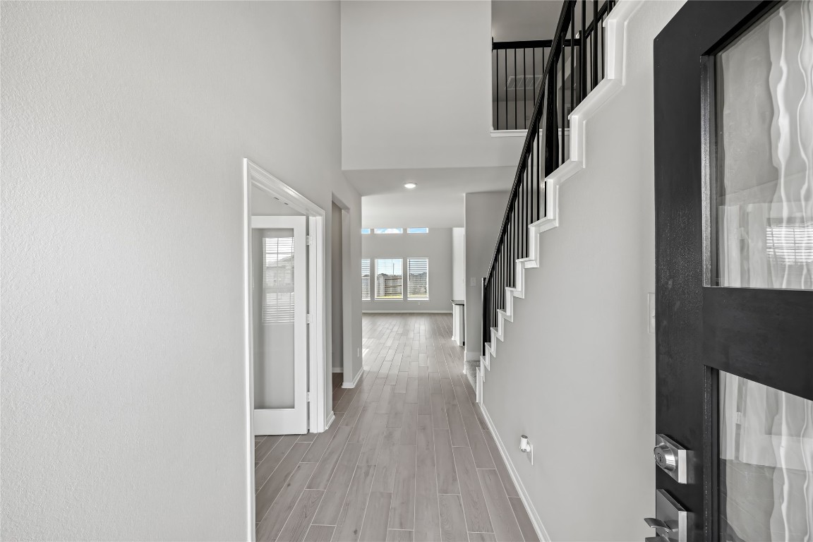 648 Canadian Trail Dayton, TX 77535 - Photo 6 of 37 a view of entryway with wooden floor and stairs
