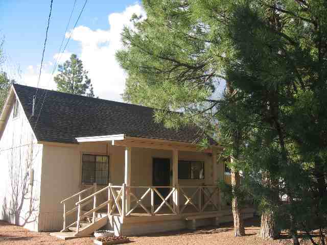 2052 Shot Gun Road Overgaard, AZ 85933 - Photo 1 of 5 a front view of a house