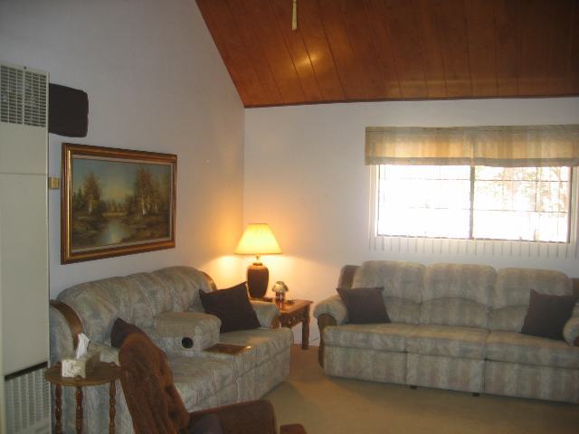 2052 Shot Gun Road Overgaard, AZ 85933 - Photo 5 of 5 a living room with furniture and a window