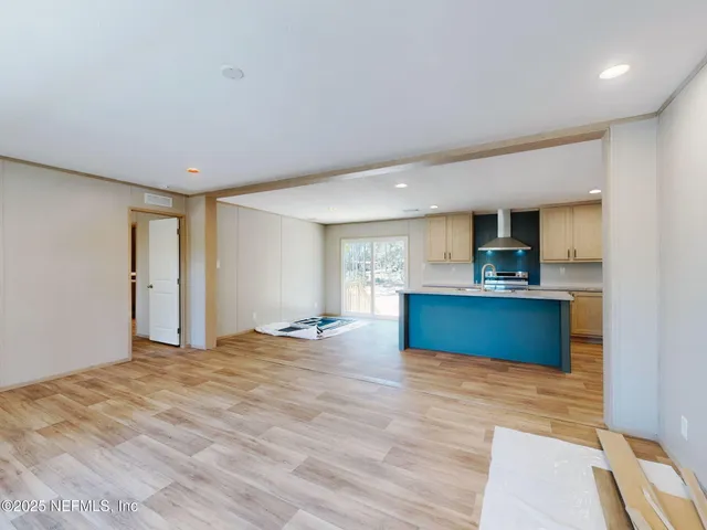 a view of kitchen with wooden floor and a sink