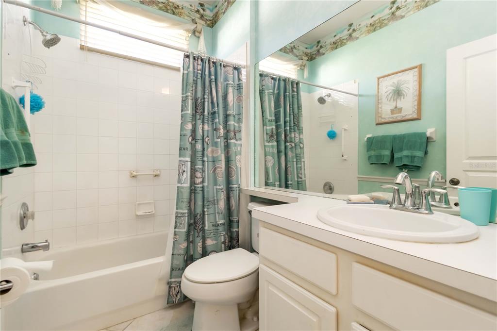 357 Fareham Drive Venice, FL 34293 - Photo 15 of 34 a bathroom with a sink toilet and shower