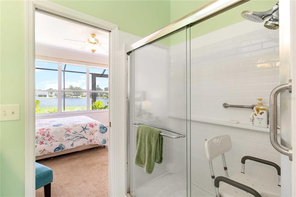 357 Fareham Drive Venice, FL 34293 - Photo 22 of 34 a bedroom with a bed and a walk in closet